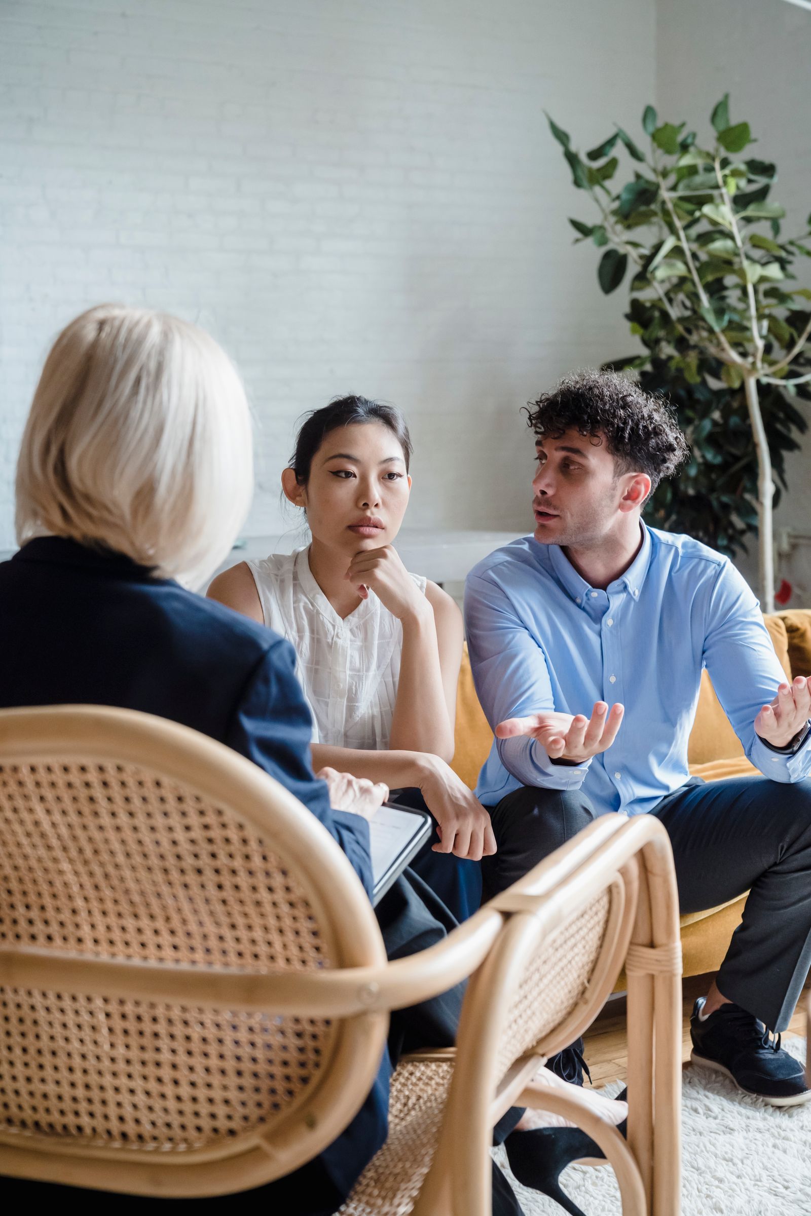 Adults meeting with a counselor
